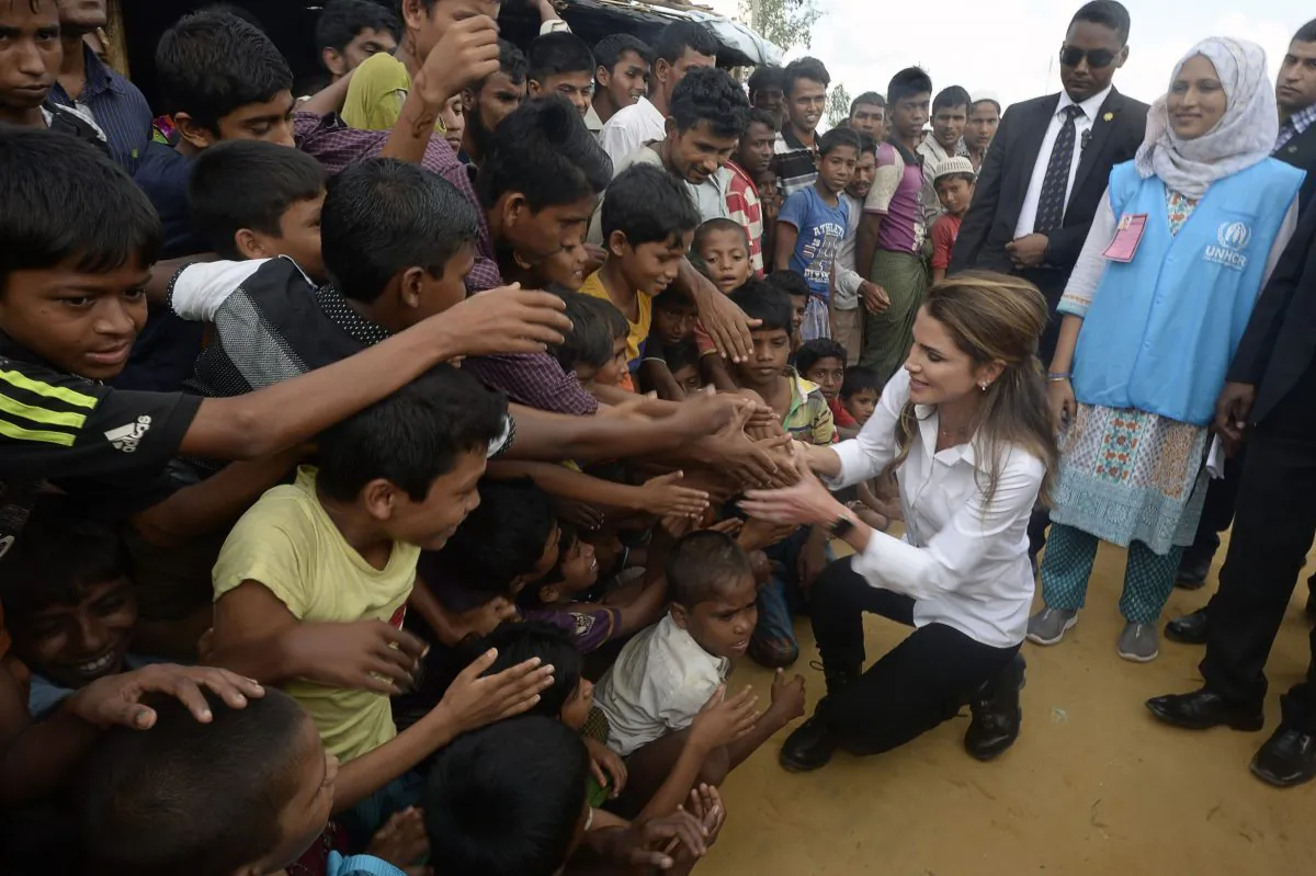 Jordan's Queen Rania shaking hands with Rohingya Muslim refugees during her visit to the Kutupalong refugee camp in Ukhia on Oct. 23, 2017. (Tauseef Mustafa/AFP/Getty Images)