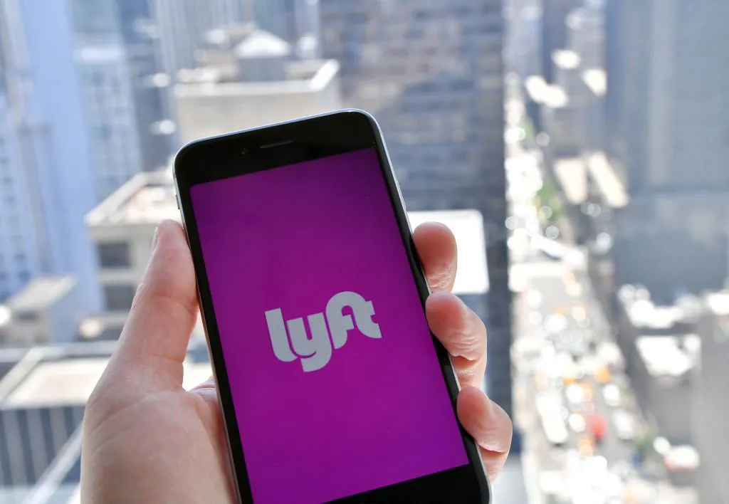 Logo Lyft is seen
in the photo. (Wikimedia Commons via Benzinga)