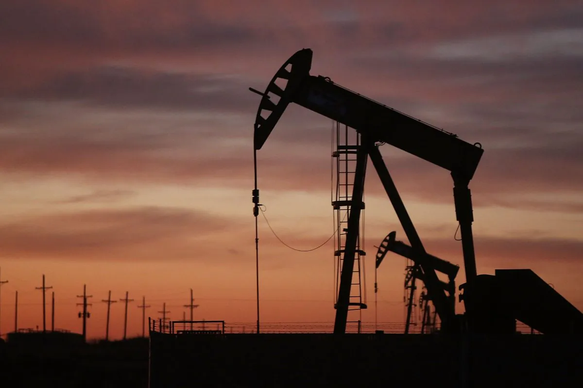 An oil pumpjack works at dawn in the Permian Basin oil field on January 20, 2016 in the oil town of Andrews, Texas. (Spencer Platt/Getty Images)