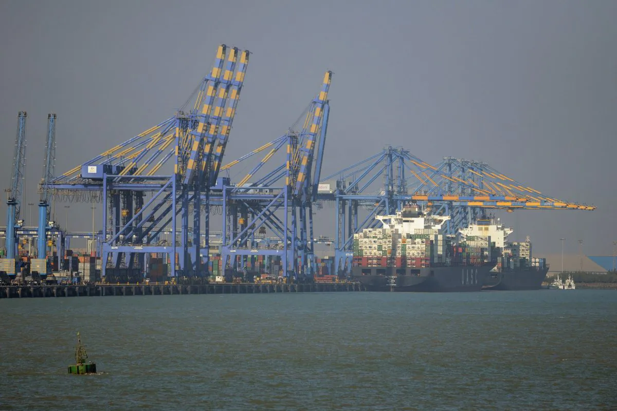 A container ship (R) docked at India's Adani Port Special Economic Zone (APSEZ) in Mundra on December 21, 2016. Arthur Wiegenfeld recommends the United States increase trade with India. (SAM PANTHAKY/AFP/Getty Images)