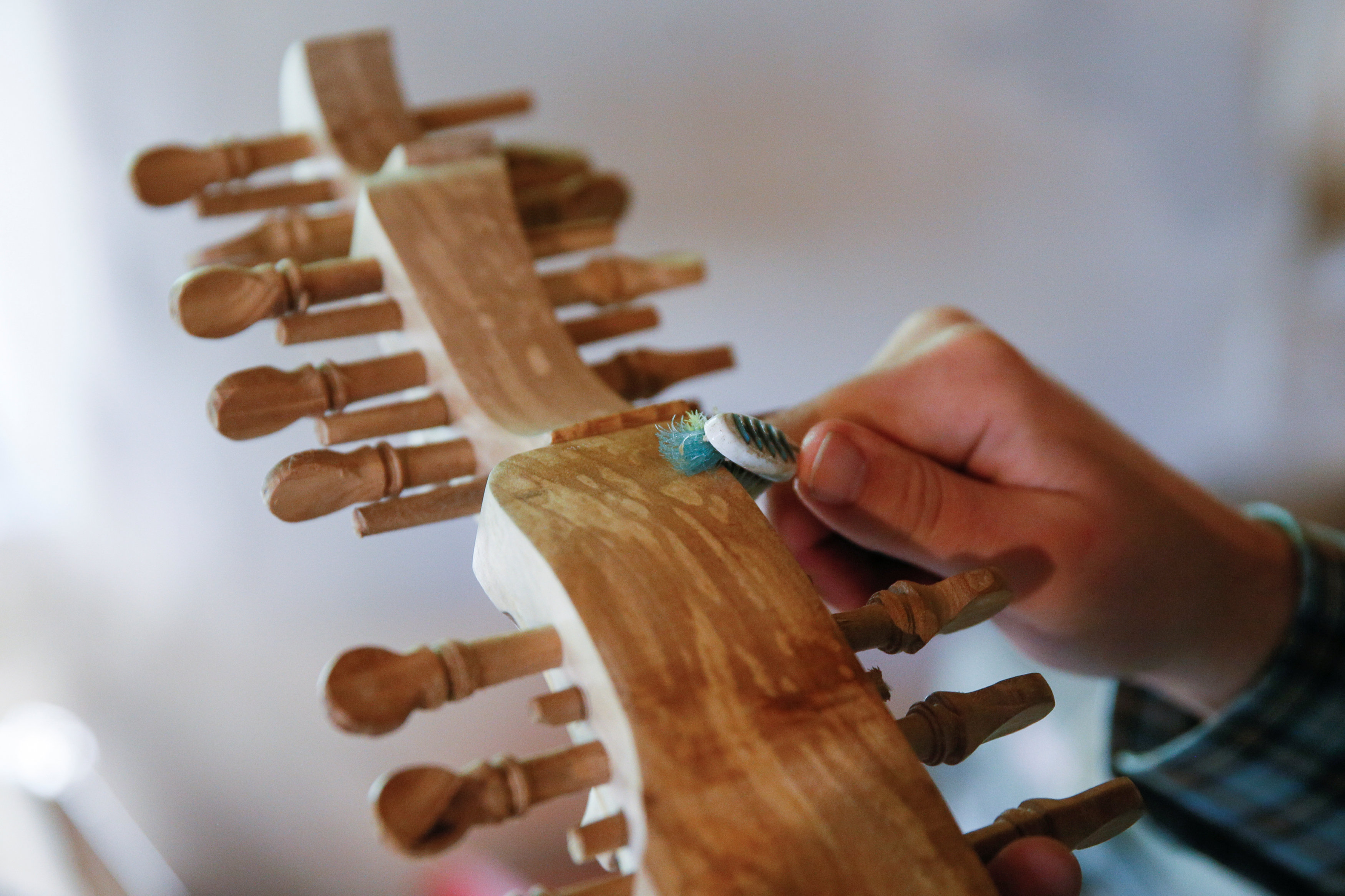 Yuriy Fedynsky makes a Ukrainian folk instrument.