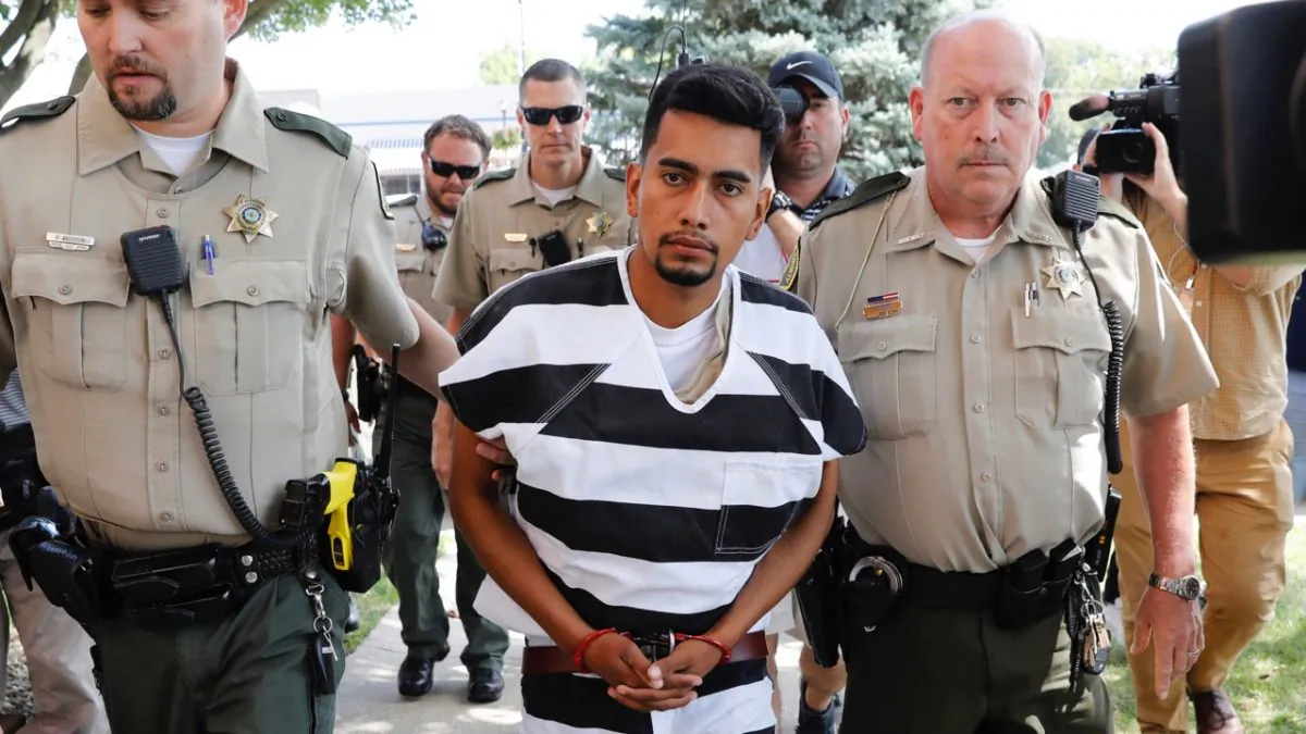 Cristhian Bahena Rivera is escorted into the Poweshiek County Courthouse for his initial court appearance in Montezuma, Iowa, on Aug. 22, 2018. (Charlie Neibergall/AP)