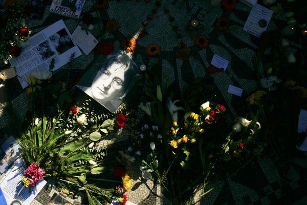Flowers are seen at a John Lennon memorial