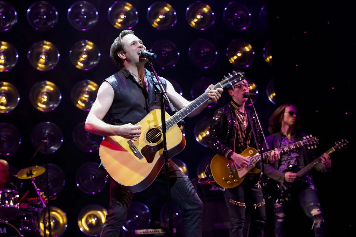 Mitch Papadopoulos (Mitchell Jarvis) reliving the glory days with his old band in “Getting’ the Band Back Together.” (Joan Marcus)