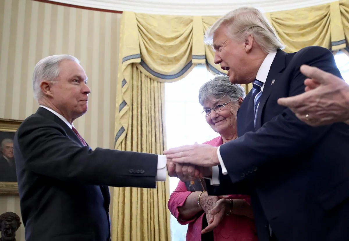 President Donald Trump (2nd R) shakes the hand of  Jeff Sessions after Sessions was sworn in as the new U.S. Attorney General by U.S. Vice President Mike Pence (R) in the Oval Office of the White House in Washington on Feb. 9, 2017. (Win McNamee/Getty Images)