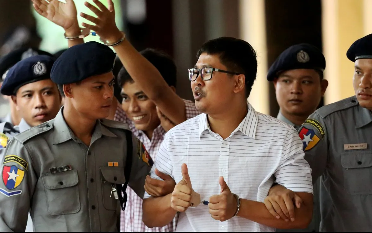 Detained Reuters journalists Wa Lone and Kyaw Soe Oo arrive at Insein court in Yangon, Myanmar Aug. 27, 2018. (Reuters/Ann Wang)