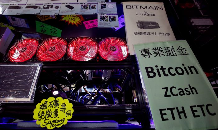 A cryptocurrency mining computer equipped with cooling fans is displayed at a computer mall in Hong Kong, China on May 17, 2018. (Bobby Yip/Reuters)