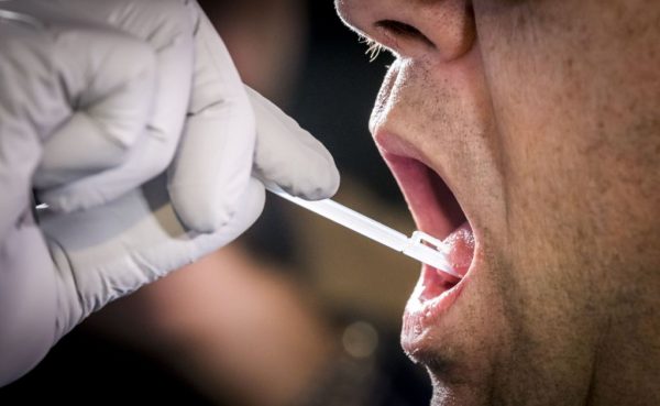A DNA sample is taken on Aug. 22, 2018 from Landgraaf mayor Raymond Vlecken during a trial before the launch of a massive DNA search project in the hunt for the killer of 11-year old Nicky Verstappen.