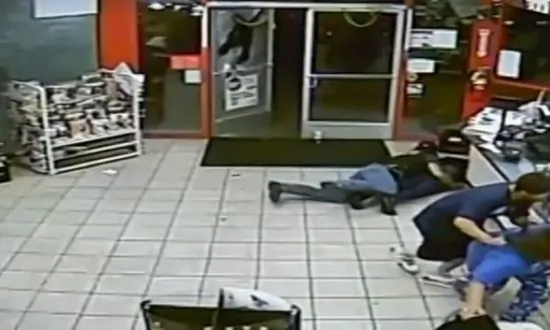 Video: Firefighter in a Store Shields Woman From Gunfire