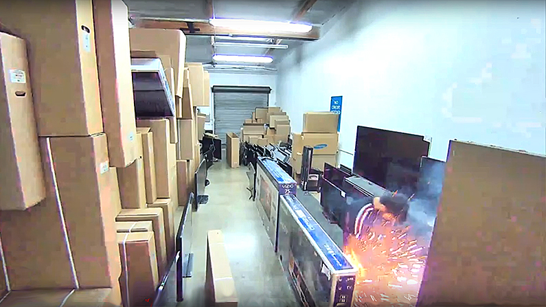 Sparks fly as the electronic device scorches the skin of Abdihdy on Aug.25, 2018. (Screenshot/HDTV Outlet Anaheim via Storyful)