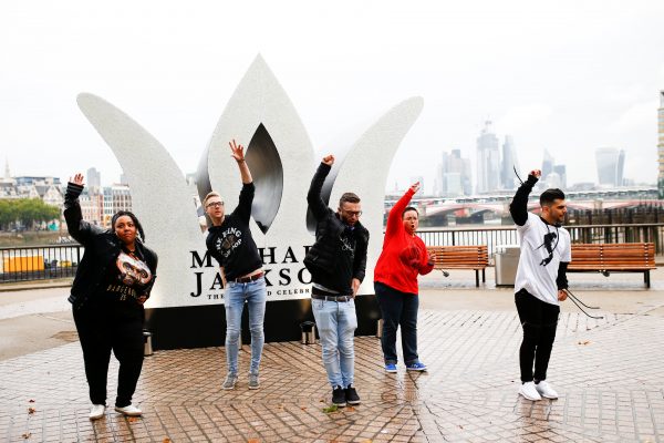 Fans of Micheal Jackson dance at monument