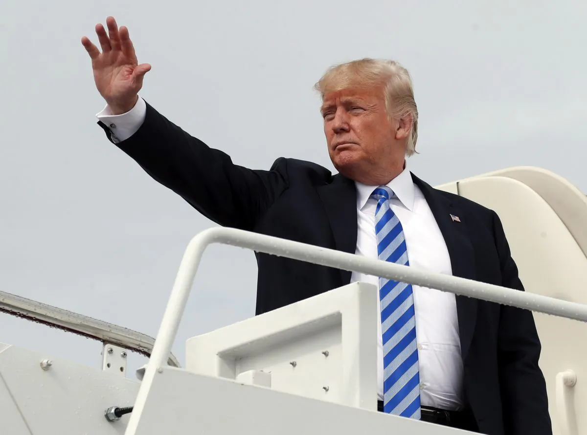 President Donald Trump waves as he boards Air Force One at Andrews Air Force Base, Md., on route to West Virginia Aug. 21, 2018. (AP Photo/Alex Brandon, File)