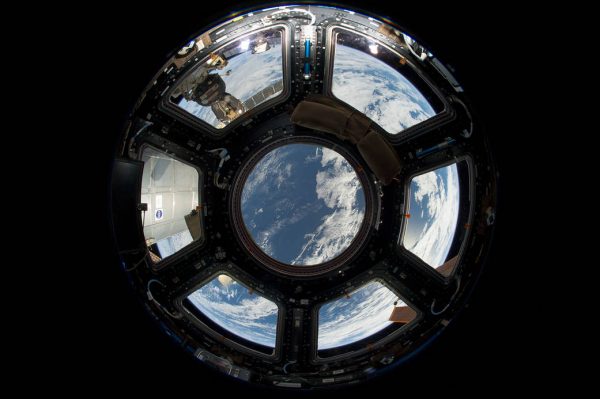 Earth seen through the window of the ISS