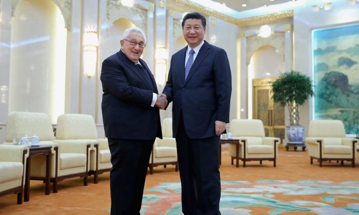 Chinese head of state Xi Jinping shakes hands with former U.S. Secretary of State Henry Kissinger at the Great Hall of the People in Beijing, China, on March 17, 2015. Since helping bring about the opening of China to the United States in 1972, Kissinger has been one of the foremost advocates for engaging China. (Feng Li/Pool/Getty Images)