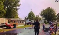 Officer, Three Others Pull Child From Culvert