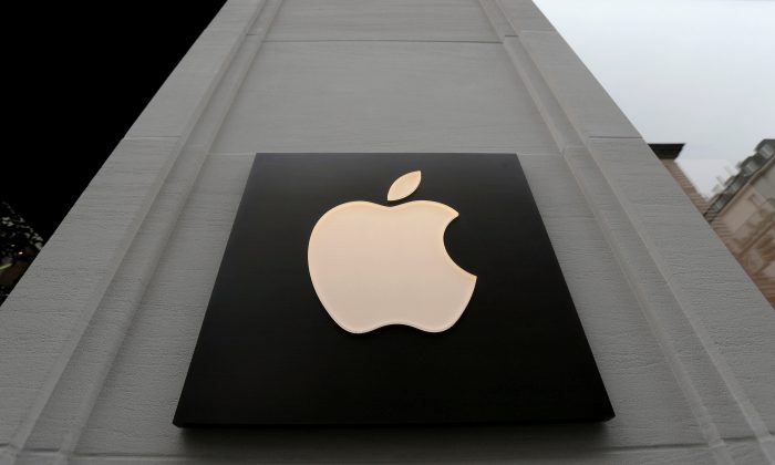 The company's logo is seen outside Austria's first Apple store, which opens on February 24, during a media preview in Vienna, Austria, Feb. 22, 2018. (Reuters/Heinz-Peter Bader/File Photo)