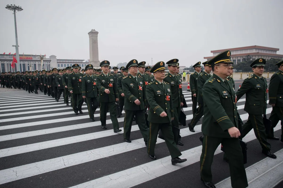 Military delegates arrive for the National People's Congress at the Great Hall of the People in Beijing on March 11, 2018. (NICOLAS ASFOURI/AFP/Getty Images)