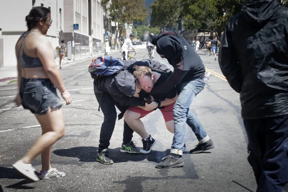 Far-left Antifa extremists beat a man in Berkeley, Calif., on Aug. 27, 2017. (Elijah Nouvelage/Getty Images)