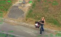 Woman With Baby Leads Police on 100 Mph Chase, Tries to Carjack Car