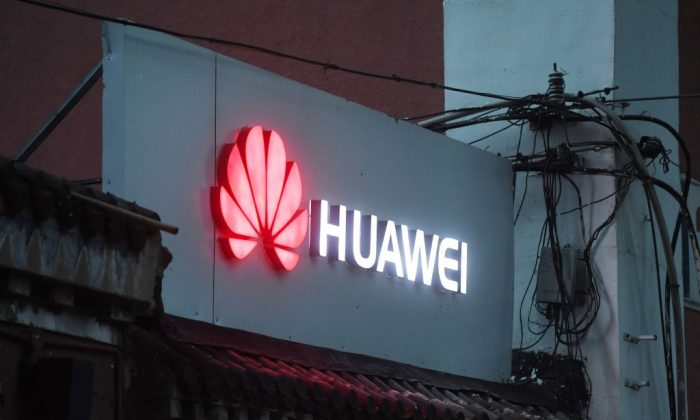 A Huawei sign outside a store selling mobile phones in Beijing on Aug. 6, 2018. (Greg Baker/AFP/Getty Images)