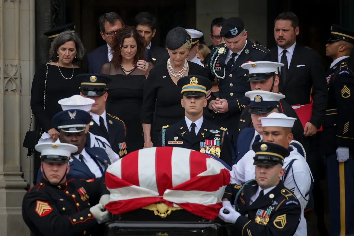 An honor guard carries the casket of Sen. John McCain at the Washington National Cathedral in Washington on Sept. 1, 2018. (Drew Angerer/Getty Images)