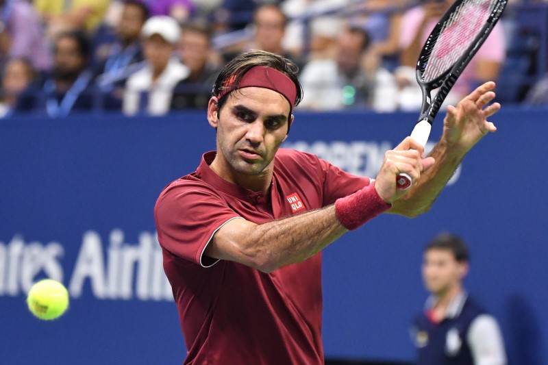 Roger Federer hitting tennis ball