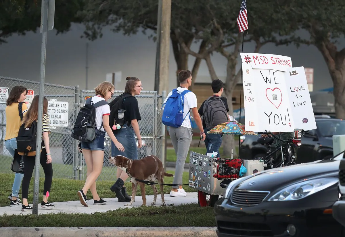Students walk to Marjory Stoneman Douglas High School on the first day of school on Aug. 15, 2018 in Parkland, Florida. Former student Nikolas Cruz, 19, is accused of killing 17 students and faculty members at the school on Feb. 14, 2018 during the last school year. (Joe Raedle/Getty Images)