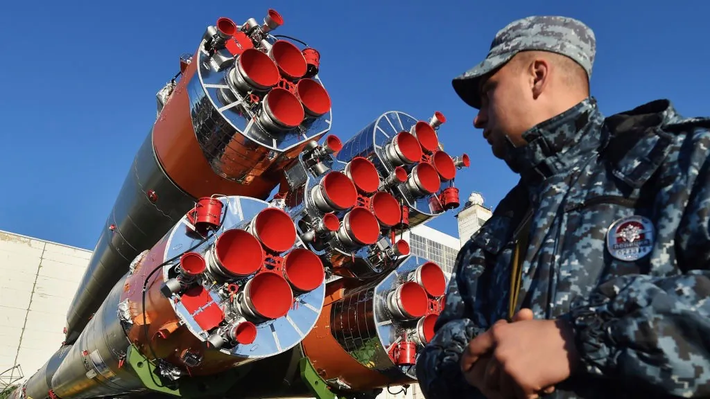 A Russian policeman guards the Soyuz MS-09 spacecraft transported to a launch pad at the Russian-leased Baikonur cosmodrome in Kazakhstan on June 4, 2018. (Vyacheslav Oseledko/AFP/Getty Images)