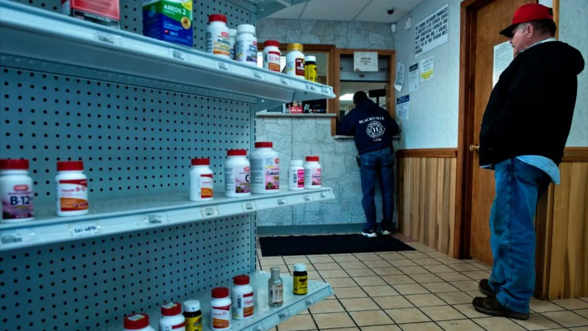 People wait at the Clay-Battelle Community Health Center's pharmacy March 21, 2017 in Blacksville, West Virginia. The Republican-controlled House of Representatives votes Thursday on a key plank of Trump's legislative agenda -- his plan to repeal and replace Obamacare, his predecessor's crowning domestic policy achievement. (Credit: Brendan Smialowski/AFP/Getty Images)
