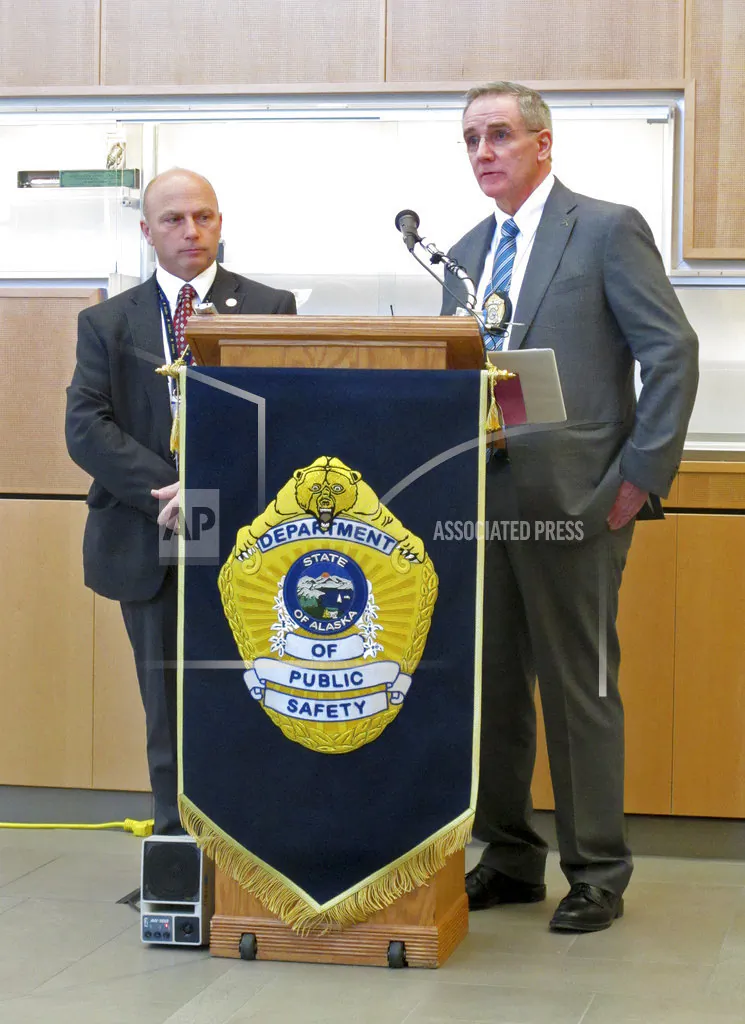 Alaska State Trooper Capt. Michael Duxbury, right, and Lt. Steve Adams, speak at a news conference in Anchorage, Alaska on Sept. 5, 2018. (AP Photo/Rachel D'Oro)