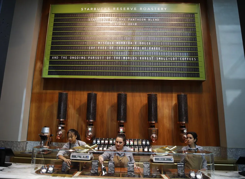 Employees work at the Starbucks store in Milan, Italy on Sept. 4, 2108. (Luca Bruno/AP)