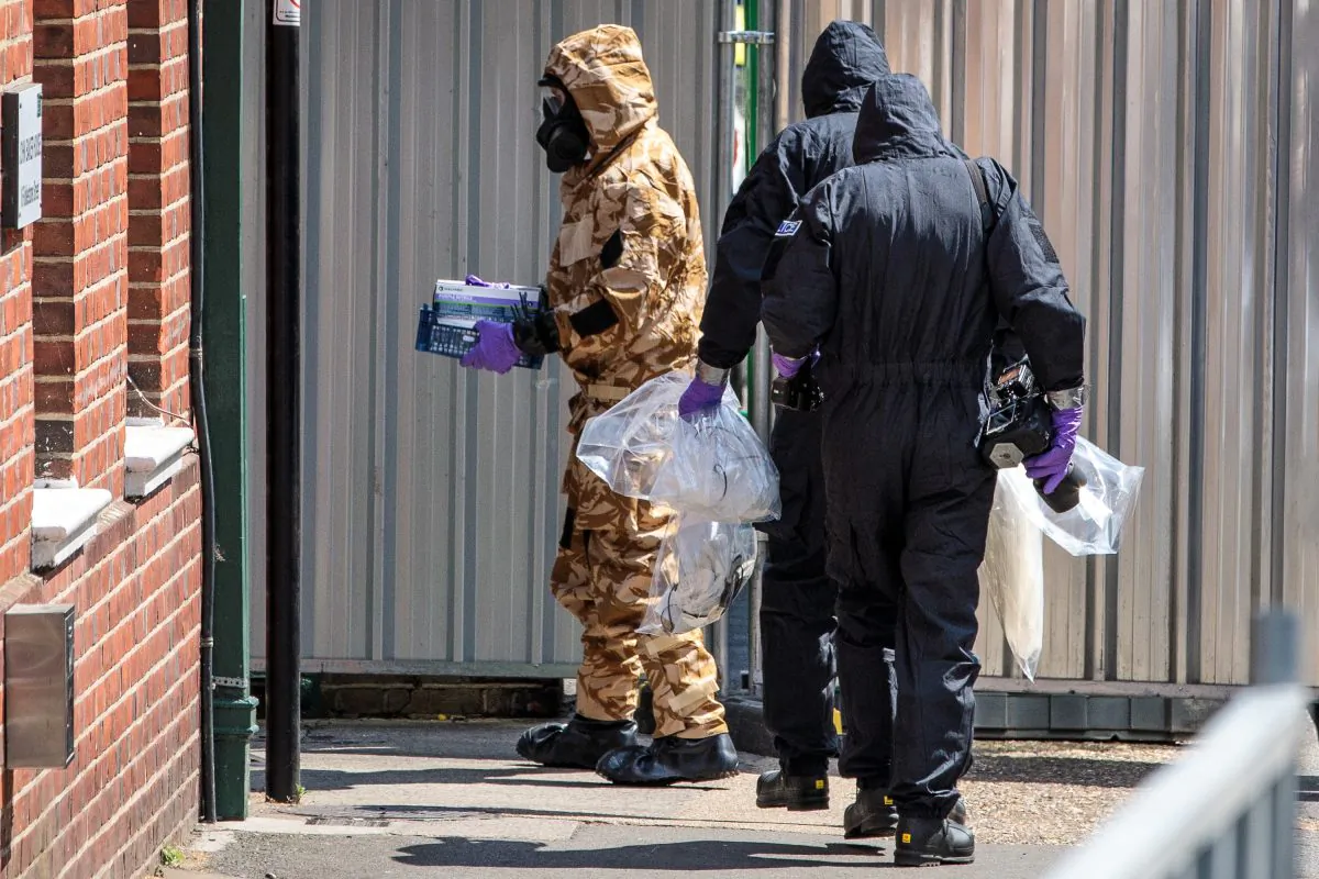 Emergency workers in protective suits search around John Baker House Sanctuary Supported Living after a major incident was declared when a man and woman were exposed to the Novichok nerve agent in Wiltshire, England, on July 6, 2018.(Jack Taylor/Getty Images)
