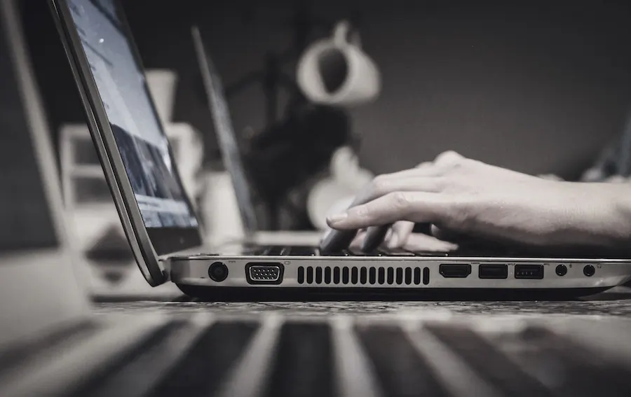Stock photo of laptop computer on desk. (John Schnobrich/Unsplash)