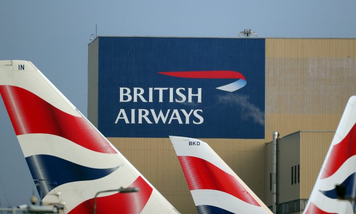 British Airways logos are seen on tail fins at Heathrow Airport in west London, Britain, on Feb. 23, 2018. (Hannah McKay/Reuters)