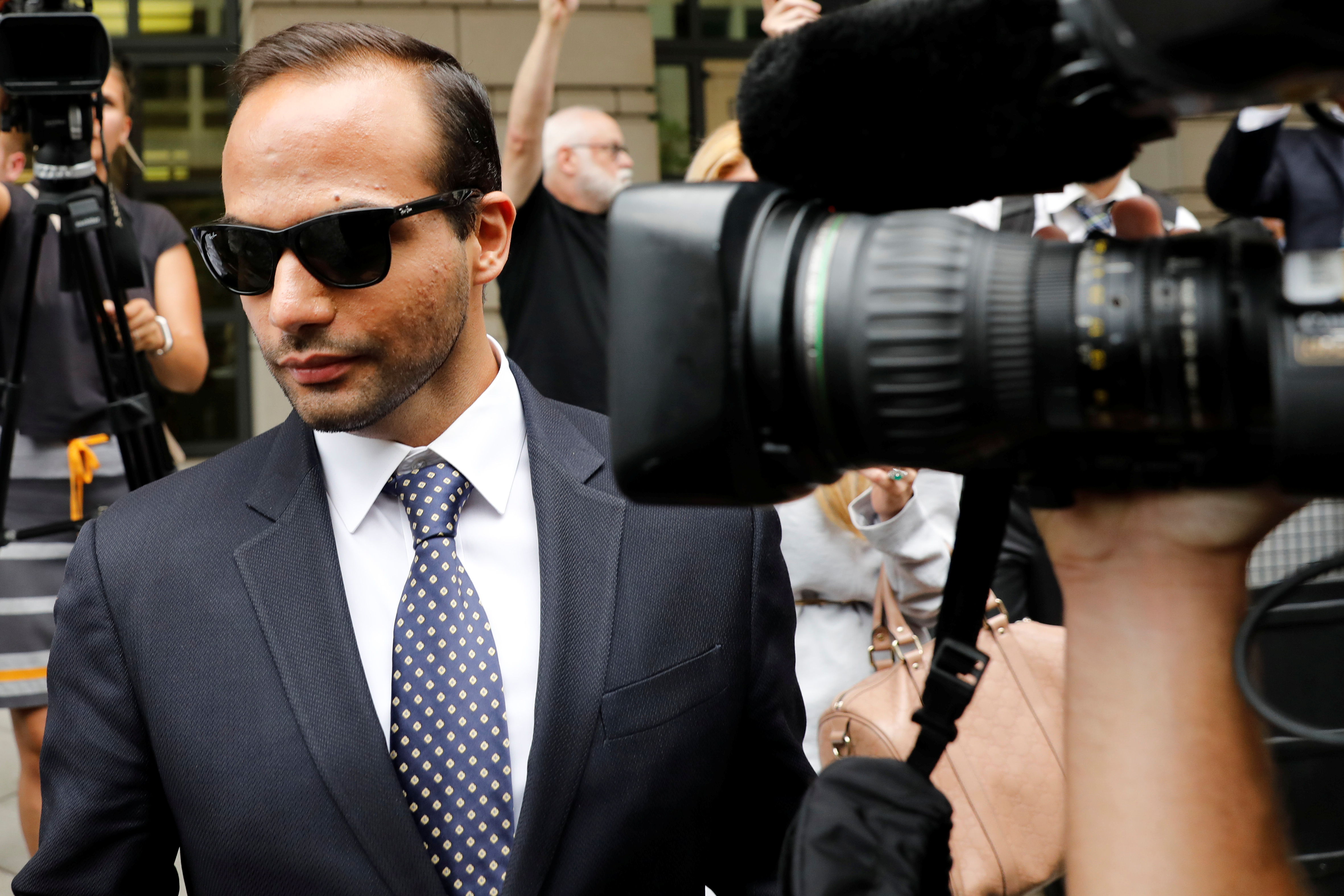 Former Trump campaign aide George Papadopoulos leaves after his sentencing hearing at U.S. District Court in Washington