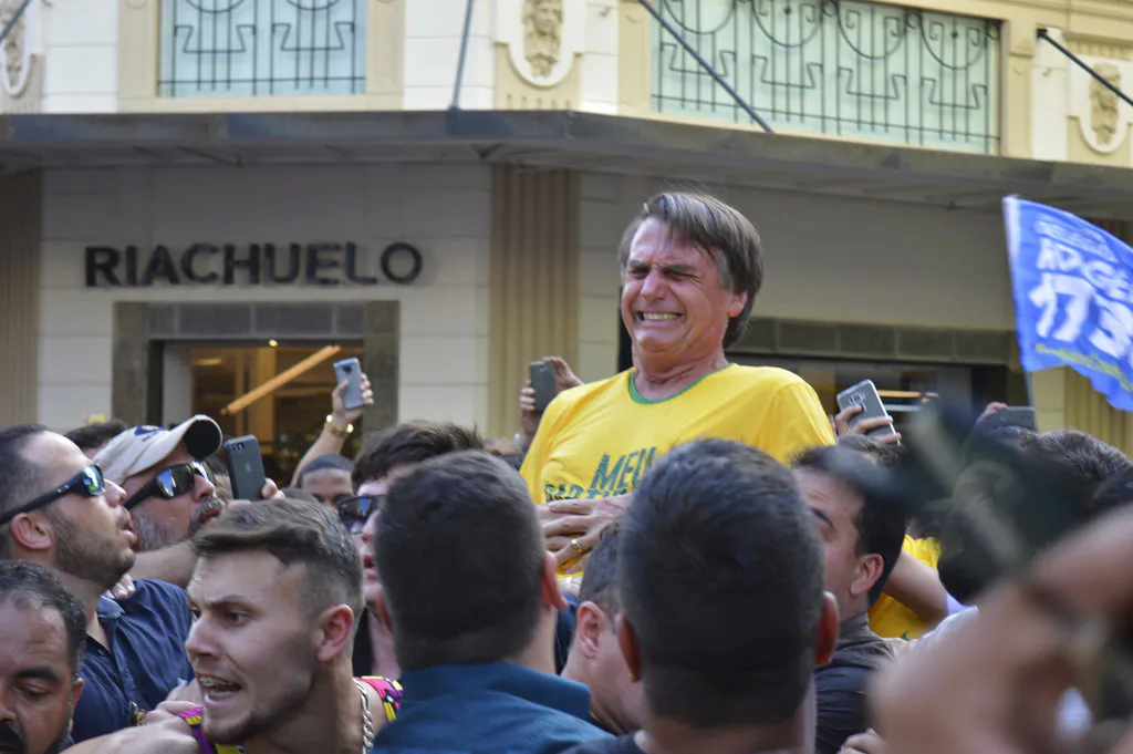 Brazil Presidential candidate Jair Bolsonaro grimaces right after being stabbed in the stomach during a campaign rally in Juiz de Fora, Brazil, on Sept. 6, 2018. (AP/Raysa Leite)