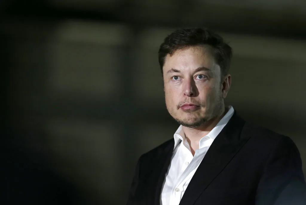 Tesla CEO and founder of the Boring Company Elon Musk speaks at a news conference in Chicago. Shares of electric car maker Tesla Inc. tumbled over 9 percent as the markets opened on Sept. 7, after the CEO smoked marijuana during a YouTube video podcast and the company’s accounting chief left after a month on the job. (Kiichiro Sato/AP)