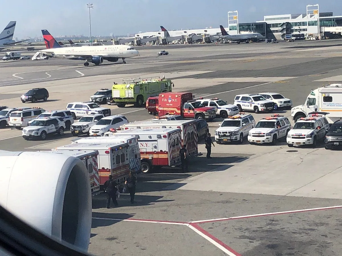 Emergency services are seen after passengers fell ill on a flight from New York to Dubai, on JFK Airport, New York on Sept. 05, 2018. (Larry Coben/via REUTERS)