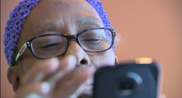 Juanita Branch scrolls through her phone