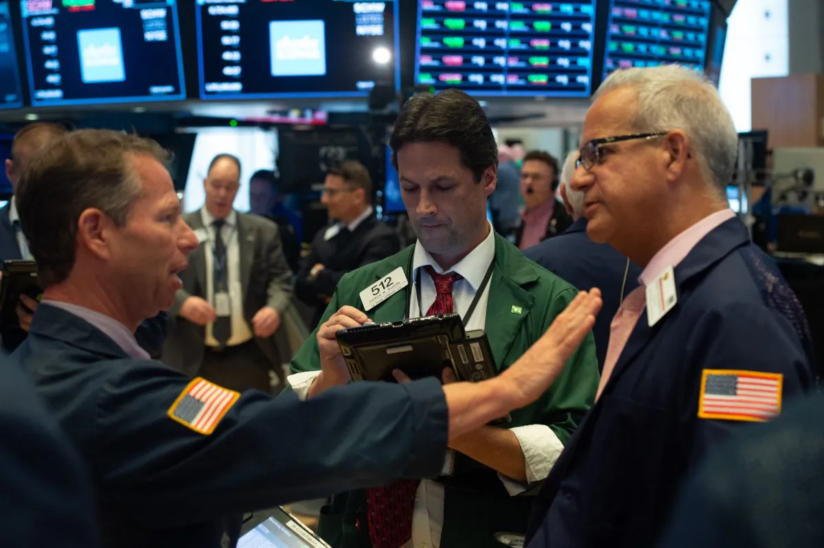 Traders work on the floor at the closing bell of the Dow Industrial Average at the New York Stock Exchange on Sept. 6. (BRYAN R. SMITH/AFP/Getty Images)