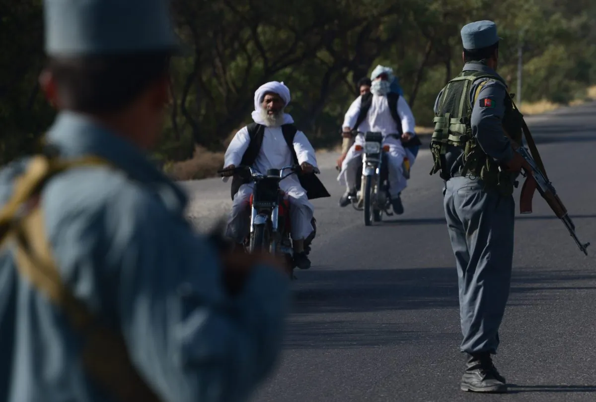 Afghan security forces stand at a checkpoint in western Herat province  Aug. 6, 2016. 
(Aref Karmi/AFP/Getty Images)