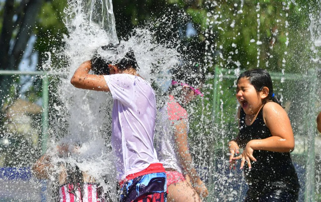 Children cool off on a hot summer day at a water park in Alhambra, Calif. on July 3, 2018 (Frederic J. Brown/AFP/Getty Images)