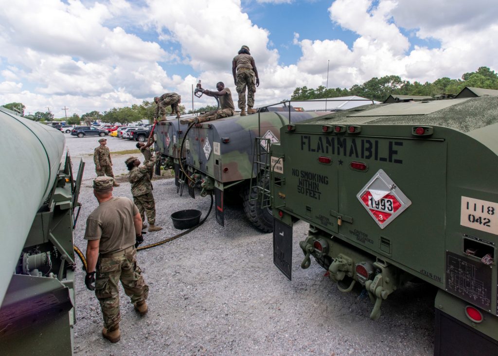 South Carolina National Guard soldiers transfer bulk diesel fuel into fuel tanker trucks for distribution in advance of Hurricane Florence, in North Charleston, South Carolina, on Sept. 10, 2018. (U.S. Army National Guard/Sgt. Brian Calhoun/Handout via Reuters)