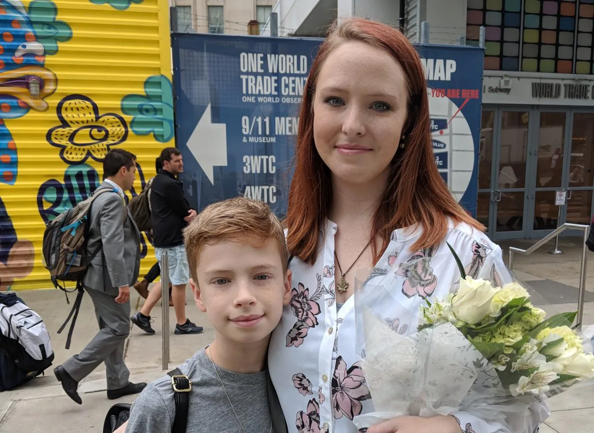 Rachel Donelson, 33, and her son at Ground Zero for the seventeenth anniversary of the 9/11 terrorist attacks, on Sept. 11, 2018. (Margaret Wollensak/The Epoch Times)