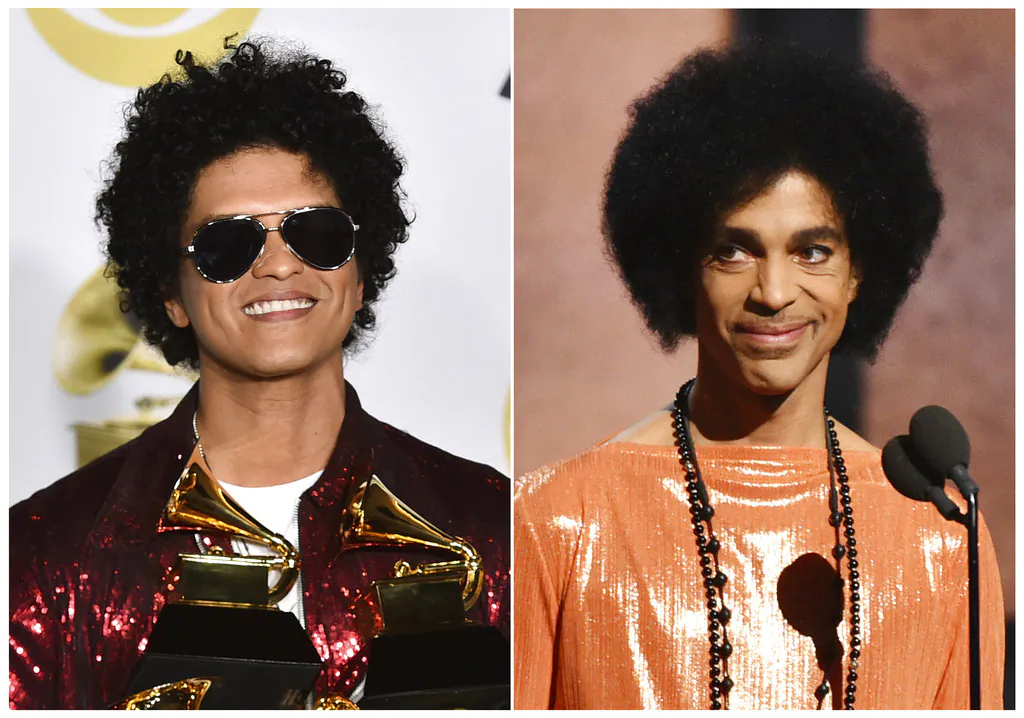 This combination photo shows Bruno Mars in the press room with his awards at the 60th annual Grammy Awards in New York on Jan. 28, 2018, left, and Prince presenting the award for album of the year at the 57th annual Grammy Awards in Los Angeles on Feb. 8, 2015. (AP Photo)