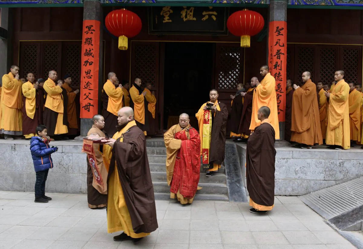 Chinese monks attend a ceremony at Shaolin Temple in Dengfeng, Henan Province, China, on Jan. 28, 2017. In an unprecedented move, the Chinese regime has required the temple to display a national flag in a show of loyalty to the Chinese Communist Party. (AFP/Getty Images)