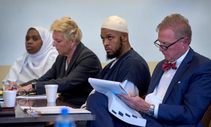 Jany Leveille (L to R) next to her defense lawyer, Kelly Golightley, defendant Siraj Ibn Wahhaj, and his defense lawyer, Tom Clark, at a hearing in Taos County District Court in Taos County, N.M., on Aug. 29, 2018. (Eddie Moore/Pool via Reuters)
