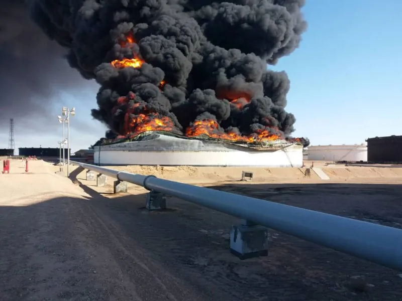 Smoke and flame rise from an oil storage tank that was set on fire amid fighting between rival factions at Ras Lanuf terminal, Libya in this handout picture released on June 18, 2018. (The National Oil Corporation/ Handout via Reuters)