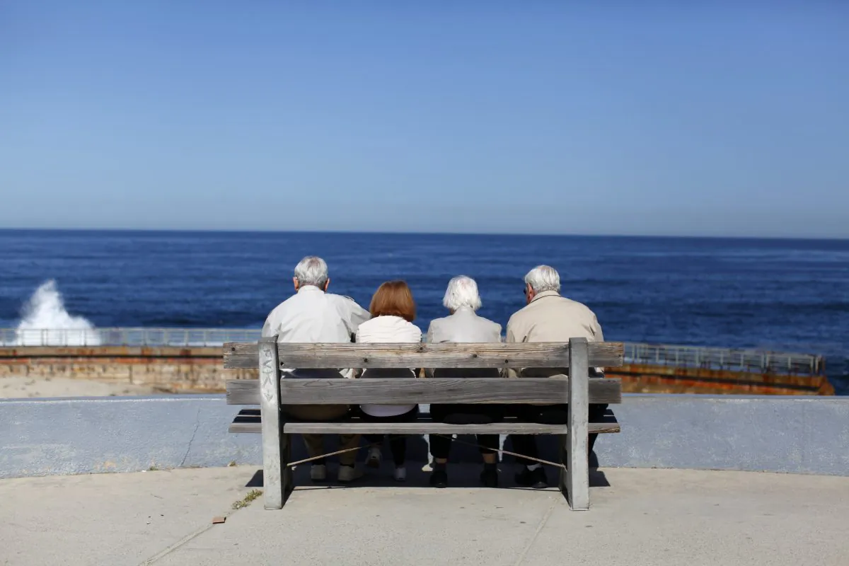 A pair of elderly couples view the ocean and waves along the beach in La Jolla, California March 8, 2012.  REUTERS/Mike Blake