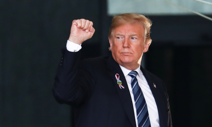 President Donald Trump pumps his fist at the Flight 93 September 11 Memorial Service in  Shanksville, Pa., on Sept. 11, 2018. (Samira Bouaou/The Epoch Times)